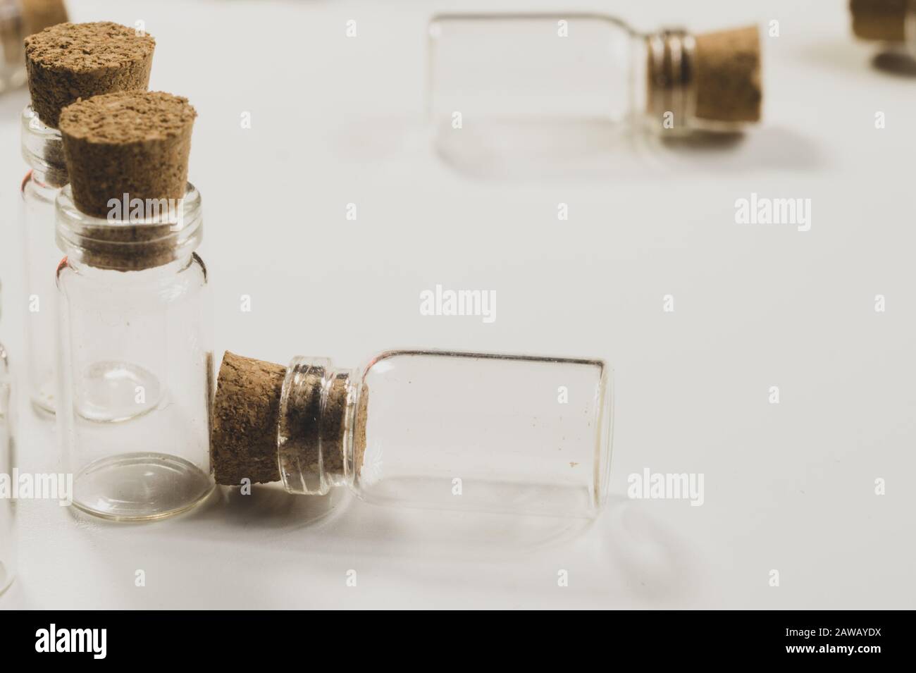 Empty little bottles with cork stopper isolated on white Stock Photo