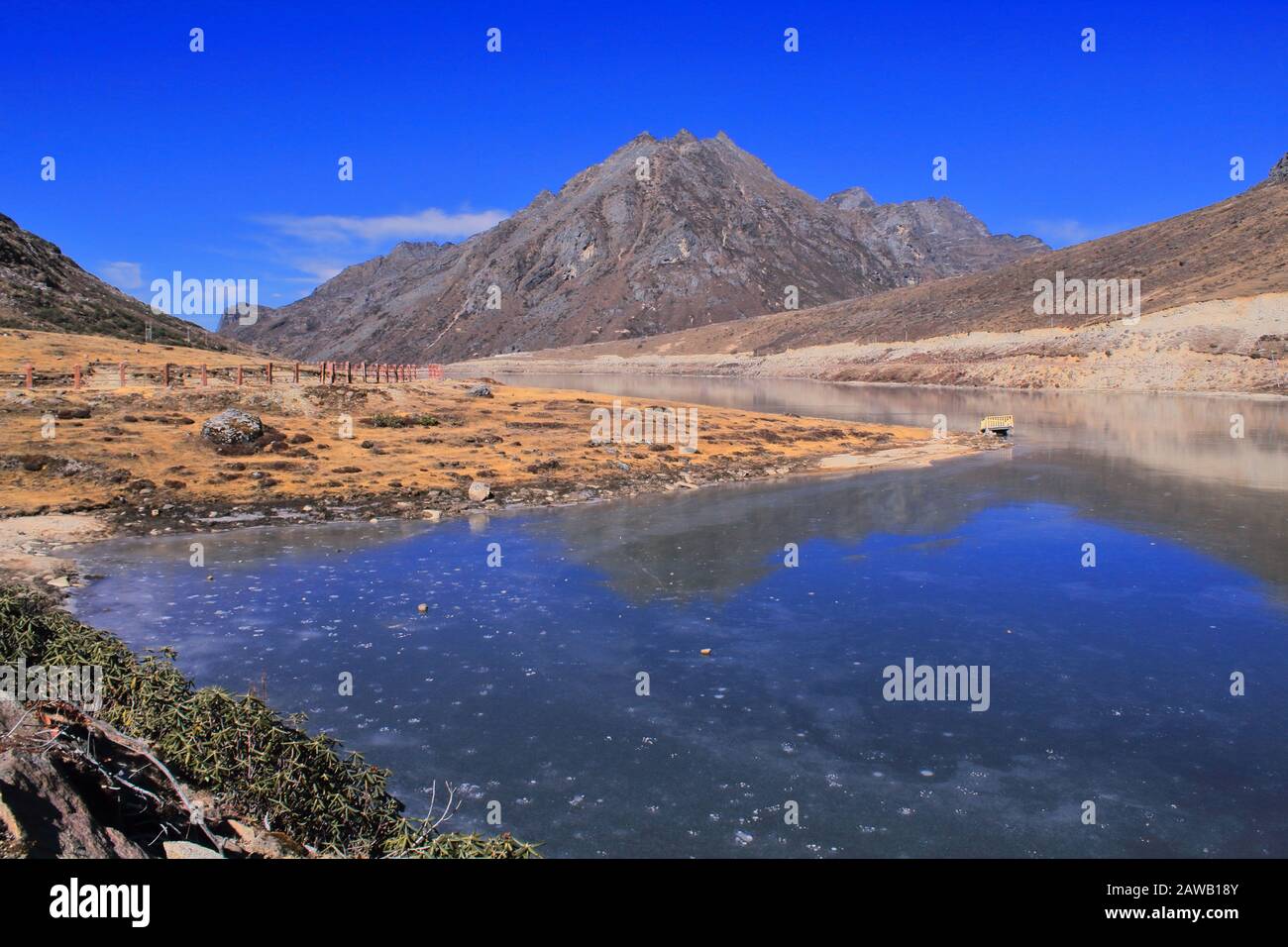 scenic alpine landscape and frozen sela lake surrounded by himalaya, in tawang district, arunachal pradesh in india Stock Photo