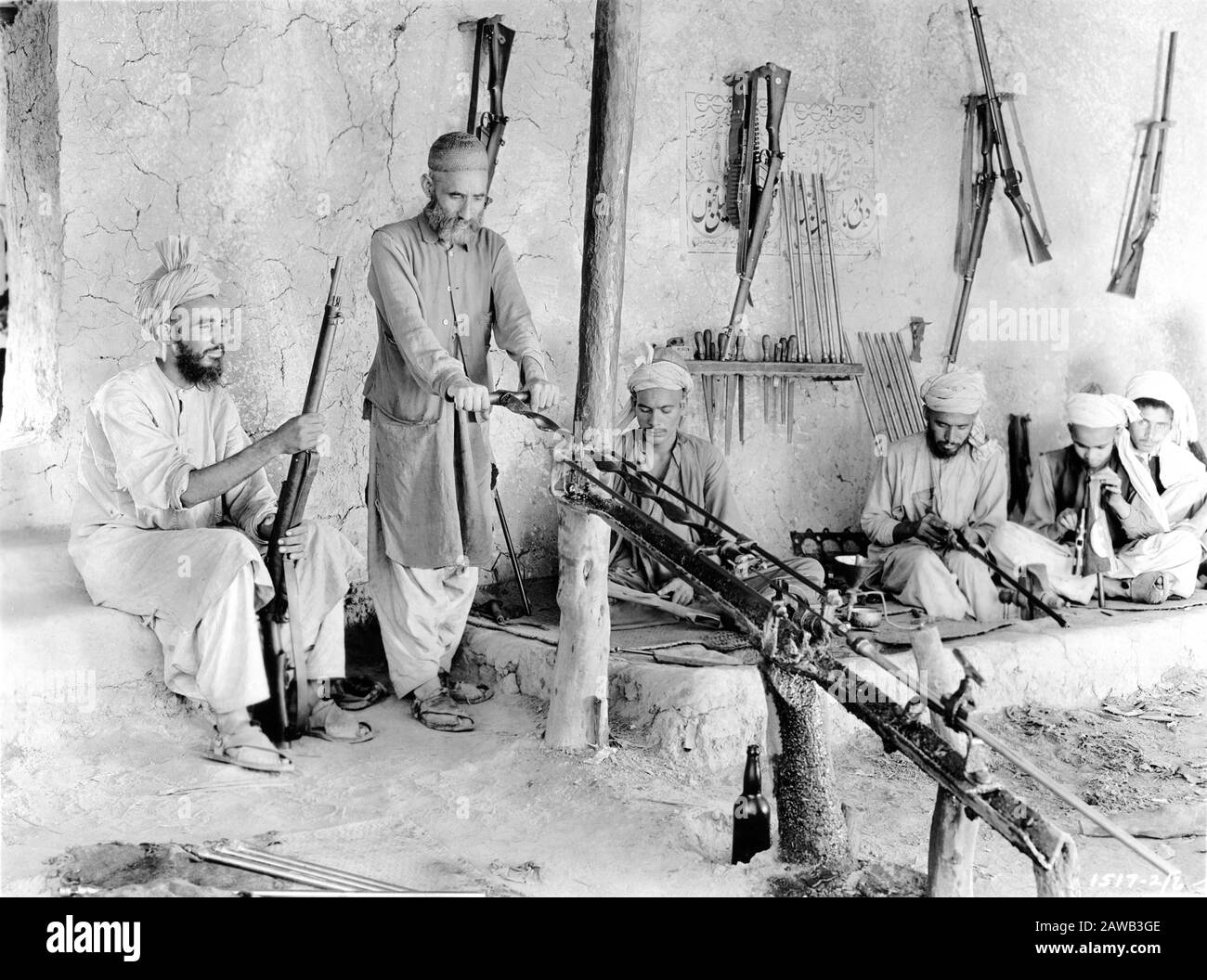 Photograph taken in 1930 by ERNEST B. SCHOEDSACK of ALFRIDI TRIBESMEN at work in a Native Rifle Factory in Independent Tribal Territory at KOHAT PASS INDIA taken on expedition to film Location Footage for proposed movie from the book THE LIVES OF A BENGAL LANCER by Francis Yeats Brown Paramount Pictures Stock Photo