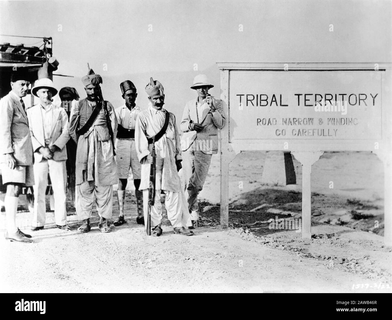 ERNEST B. SCHOEDSACK (at right in pith helmet) in Tribal Territory with part of his crew in 1930 on expedition to film Location Footage in India for proposed movie from the book THE LIVES OF A BENGAL LANCER by Francis Yeats Brown Paramount Pictures Stock Photo