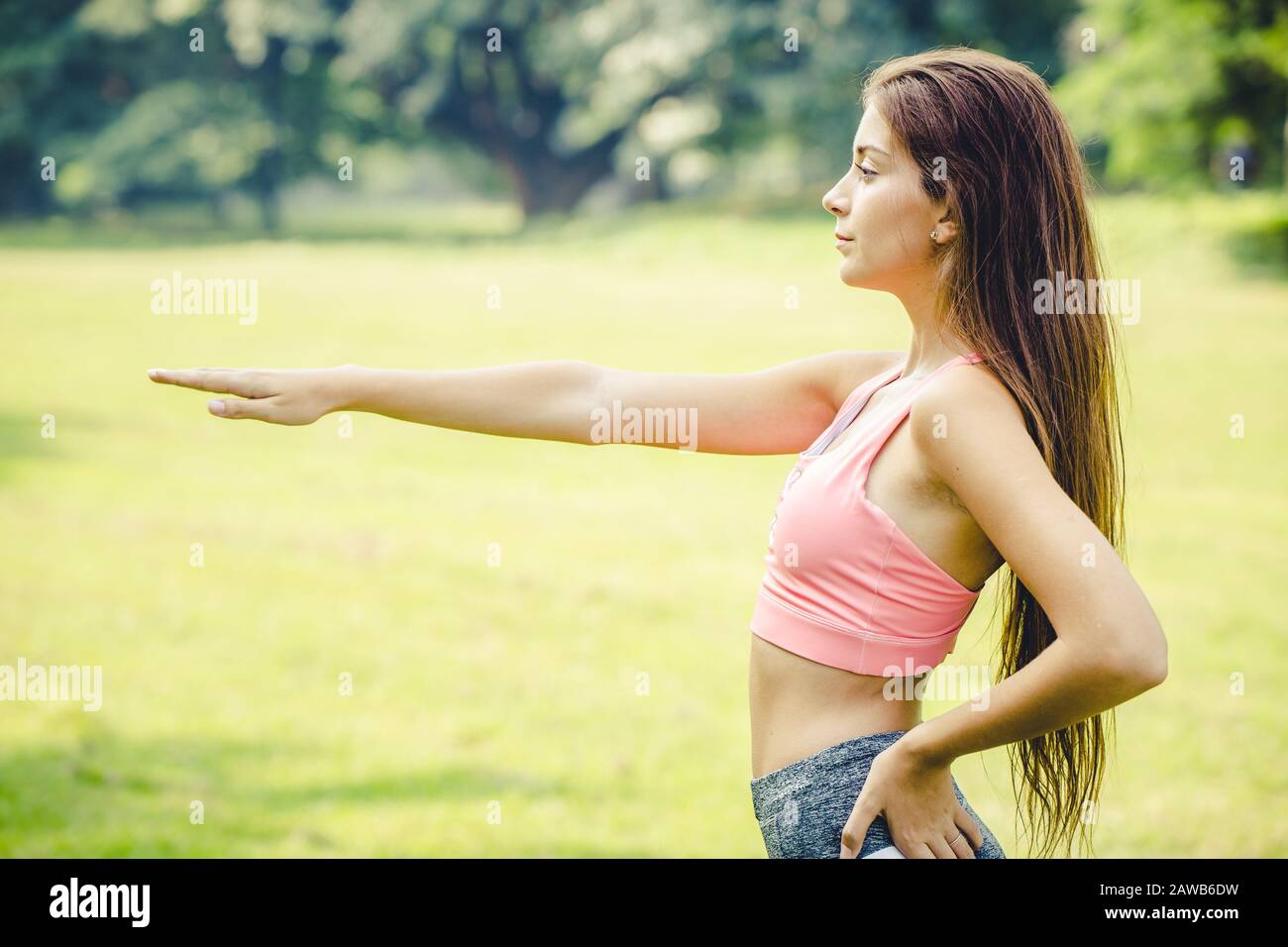 sport girl arm stretching for warm up body muscle before and after