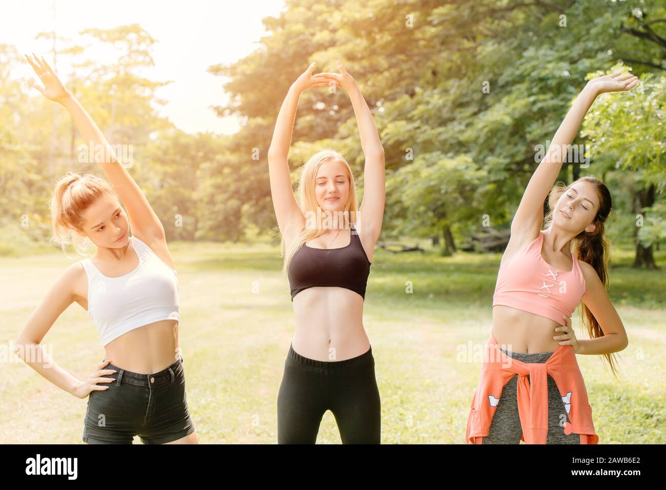 Stretching and living with Healthy lifestyle concept, Beautiful woman friend mix race with sport ware at park outdoor for exercise body. Stock Photo