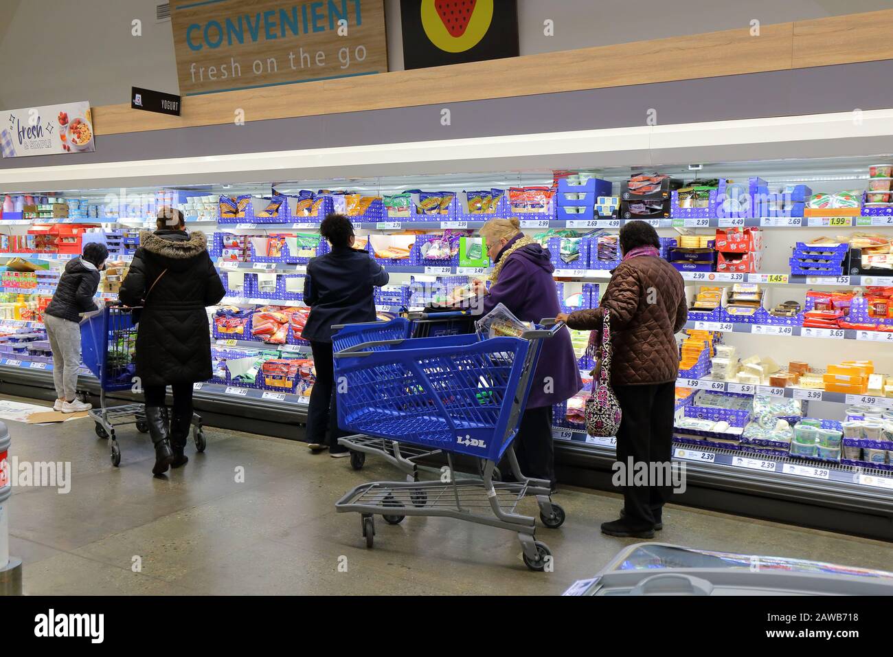 People shopping in the cheese aisle at a Lidl store in New York, NY