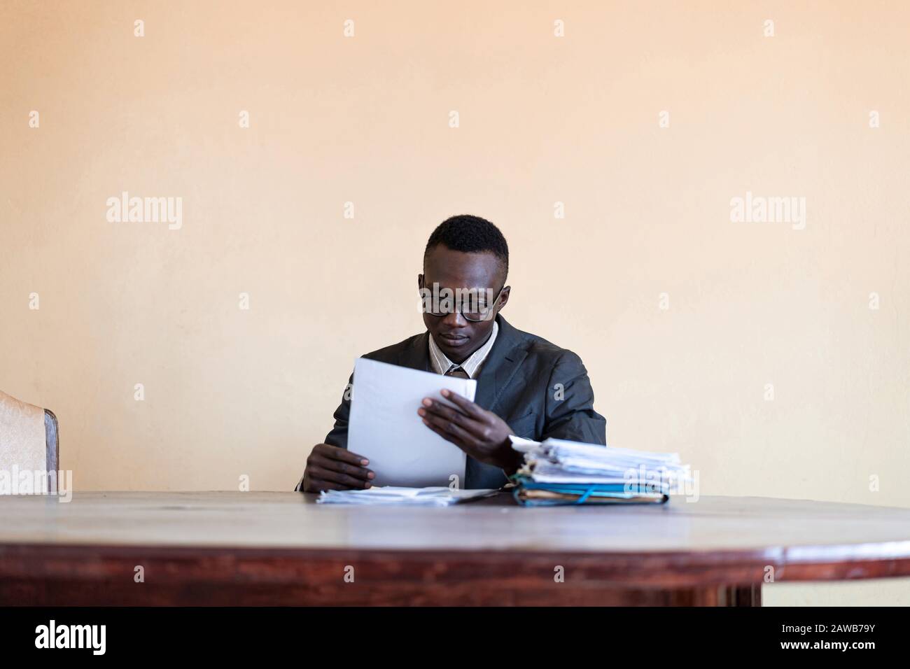 Actual happy worker concentrating worker working in the office Stock Photo