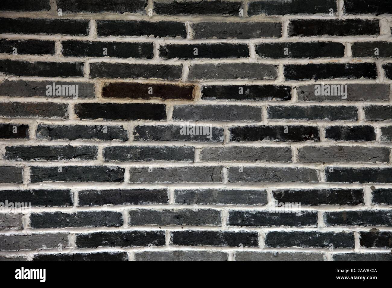 it's a photo of a wall made of brown or gray grey bricks to use as a background Stock Photo