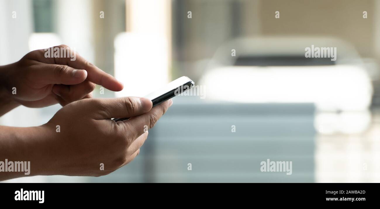 Man using smartphone using the phone for work everyday internet online Stock Photo