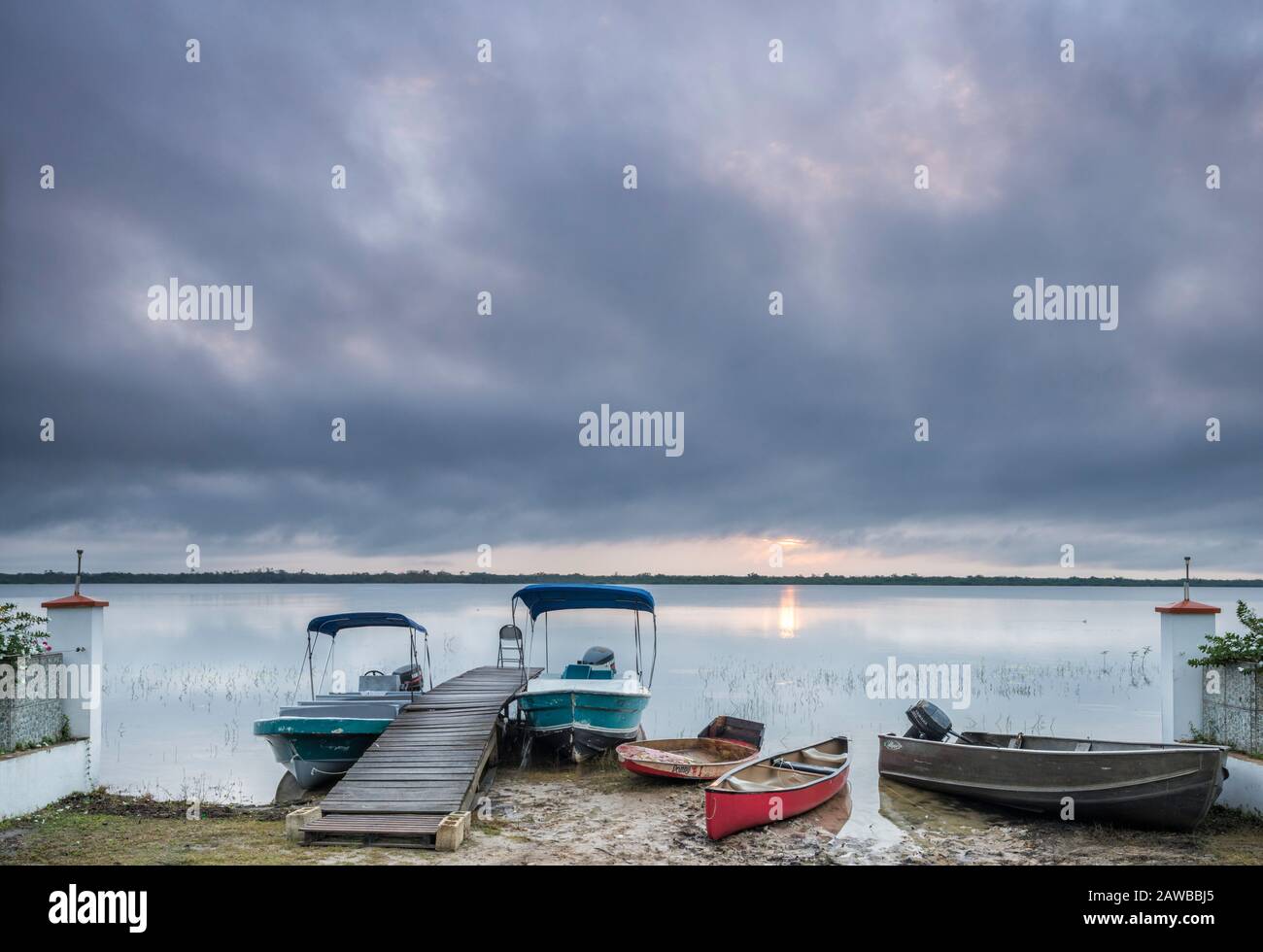 Boats moored at boardwalk at Bird's Eye View Lodge over Northern Lagoon