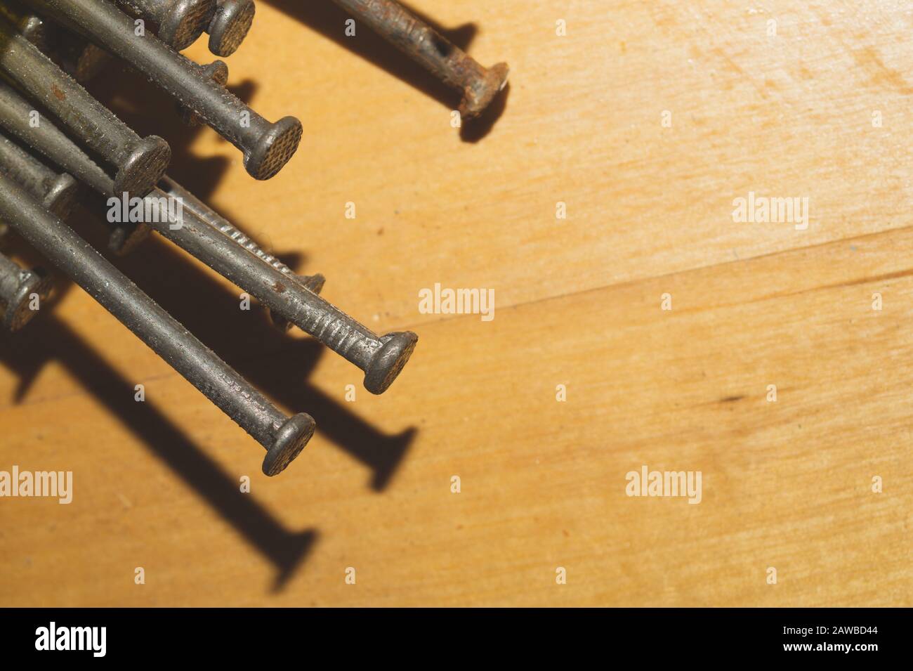 Nails on a wooden background.working tools. copy space Stock Photo