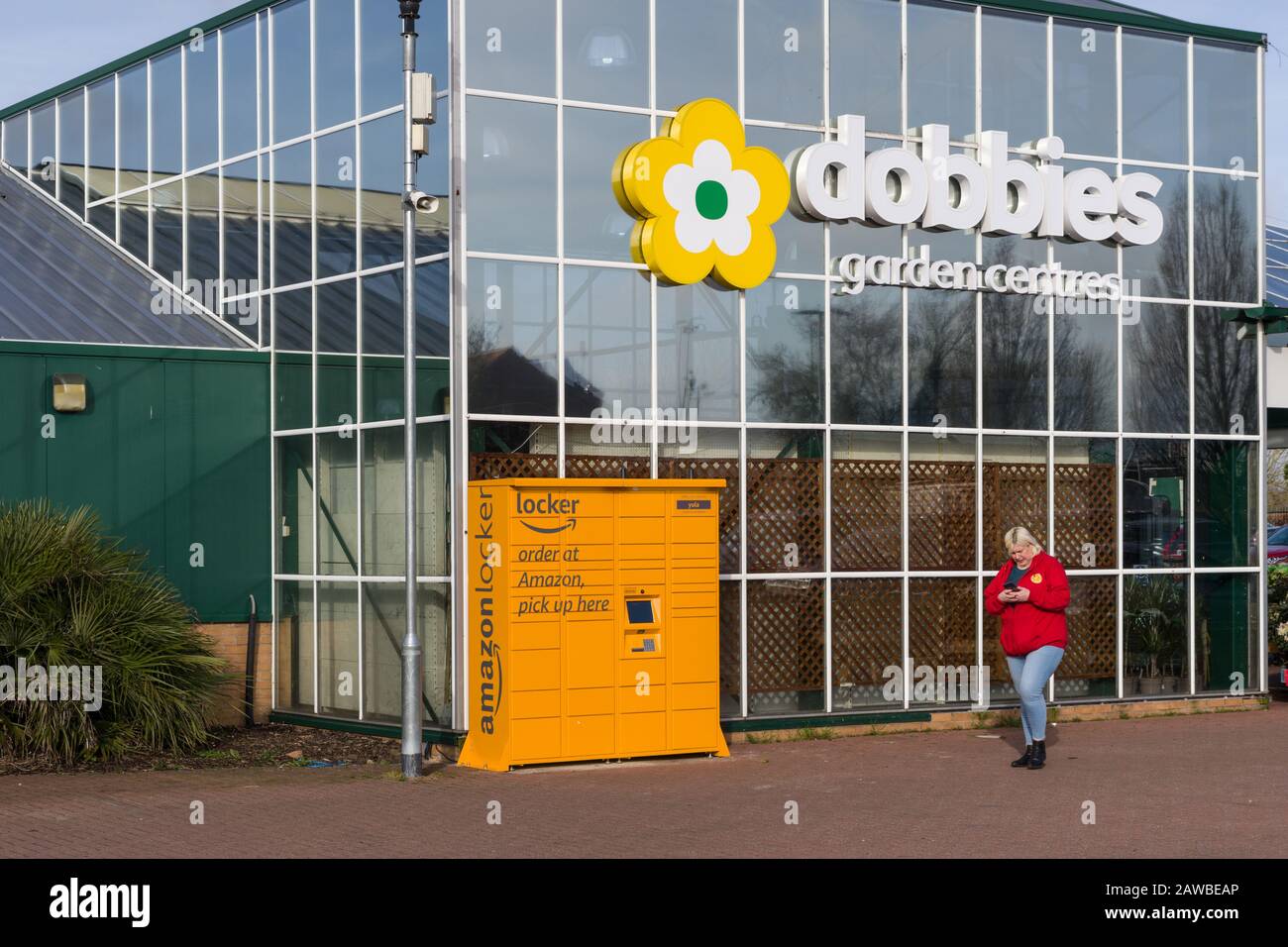 Amazon online pick-up locker, named Yula, outside Dobbies Garden Centre, Wootton, Northampton, UK Stock Photo