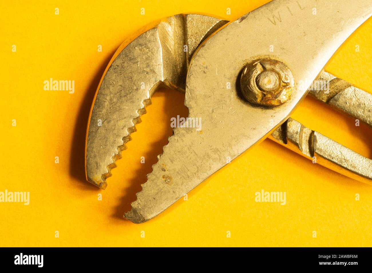 Pipe wrench on yellow background. adjustable gas wrench. instrument for repair. working tool
