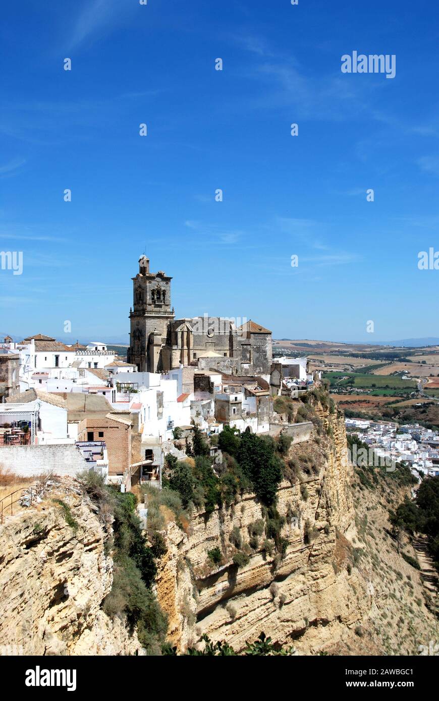 View of St Peters Church and town buildings, Arcos de la Frontera, Andalucia, Spain. Stock Photo