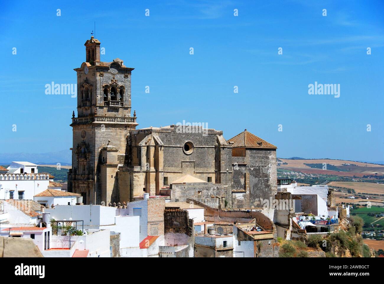 View of St Peters Church and town buildings, Arcos de la Frontera, Andalucia, Spain. Stock Photo