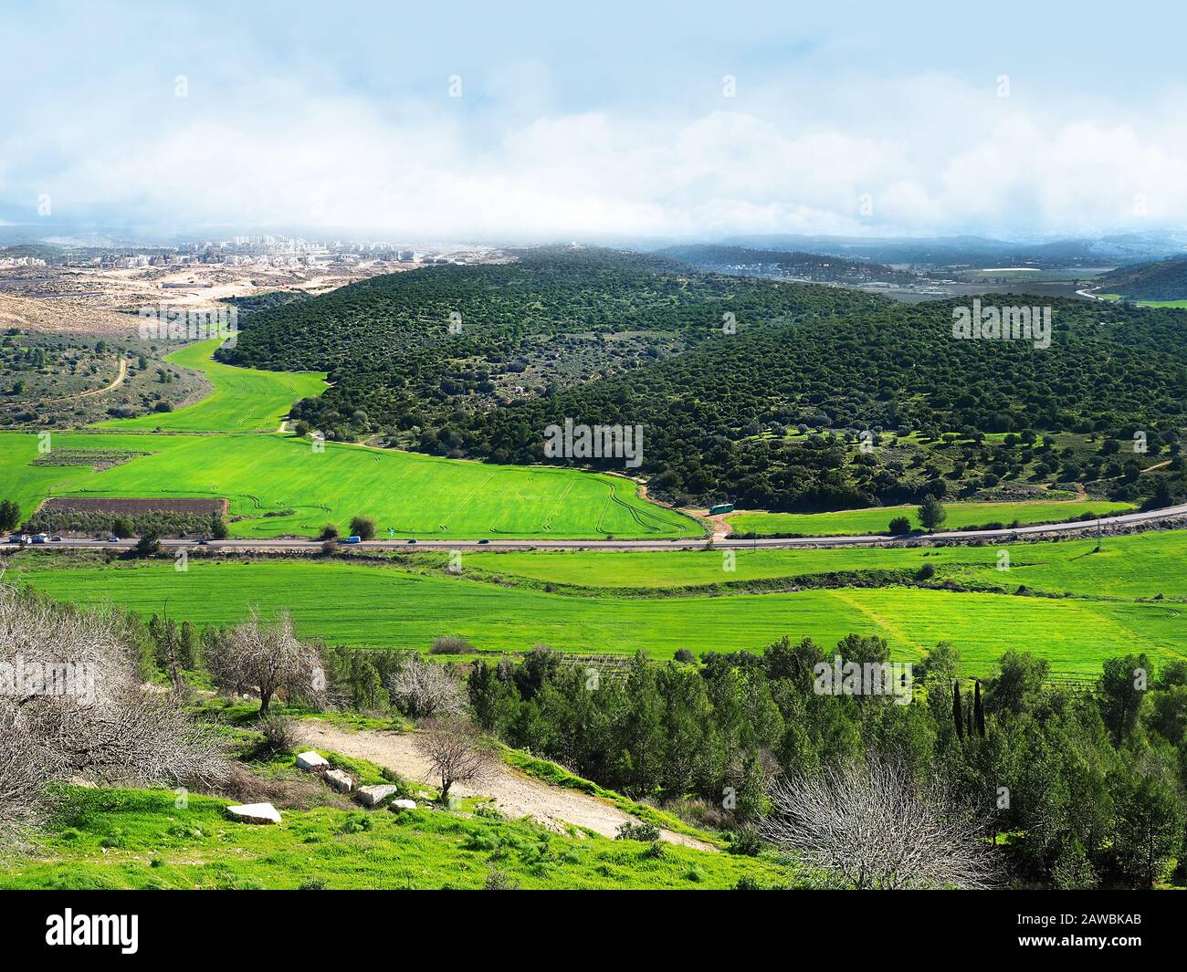 Green fields and hills in the winter of Israel. The view from the top of the hill Tel Azekah. Elah Valley - Biblical place. Stock Photo
