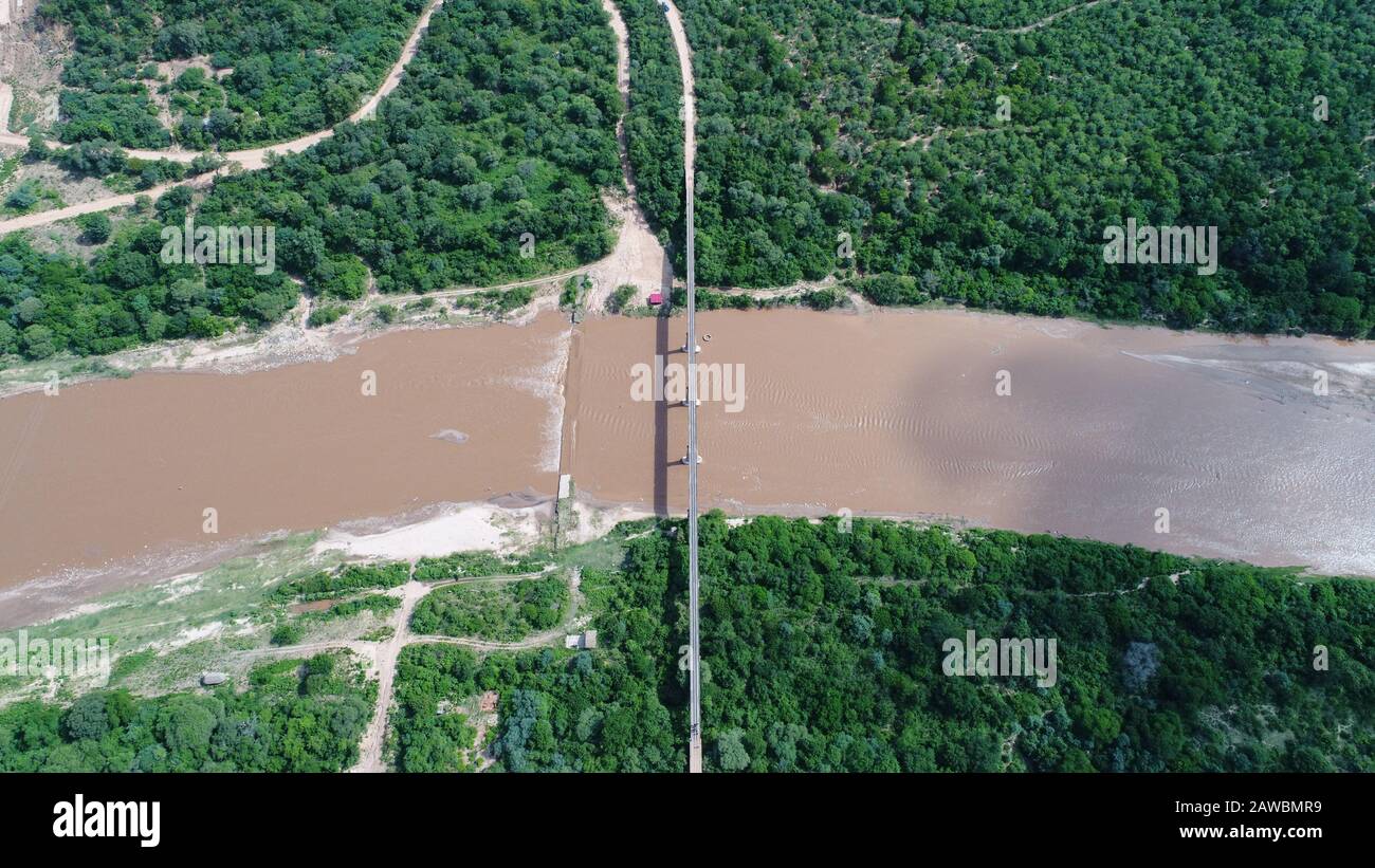 Santa Cruz. 6th Feb, 2020. Aerial photo taken on Feb. 6, 2020 shows the old railway bridge in Santa Cruz, Bolivia. Nearly 50 percent complete, according to the Bolivian Highway Administration (ABC), the 160-km El Espino-Charagua-Boyuibe Highway will directly link the country's eastern departments of Santa Cruz, Chuquisaca and Tarija with each other and with neighboring Paraguay and Argentina. TO GO WITH 'Commentary: Bolivian highway project, a vivid symbol of China-LatAm win-win cooperation' Credit: Xin Yuewei/Xinhua/Alamy Live News Stock Photo