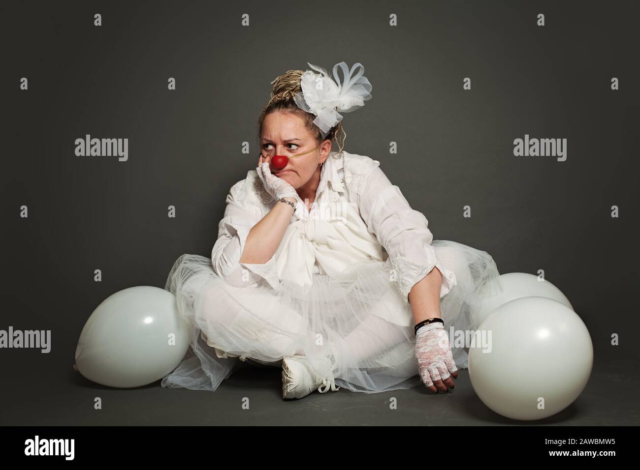Sad thinkinking woman clown portrait Stock Photo