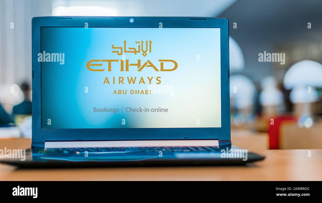 POZNAN, POL DEC 11, 2019 Laptop computer displaying logo of Etihad Airways headquartered in