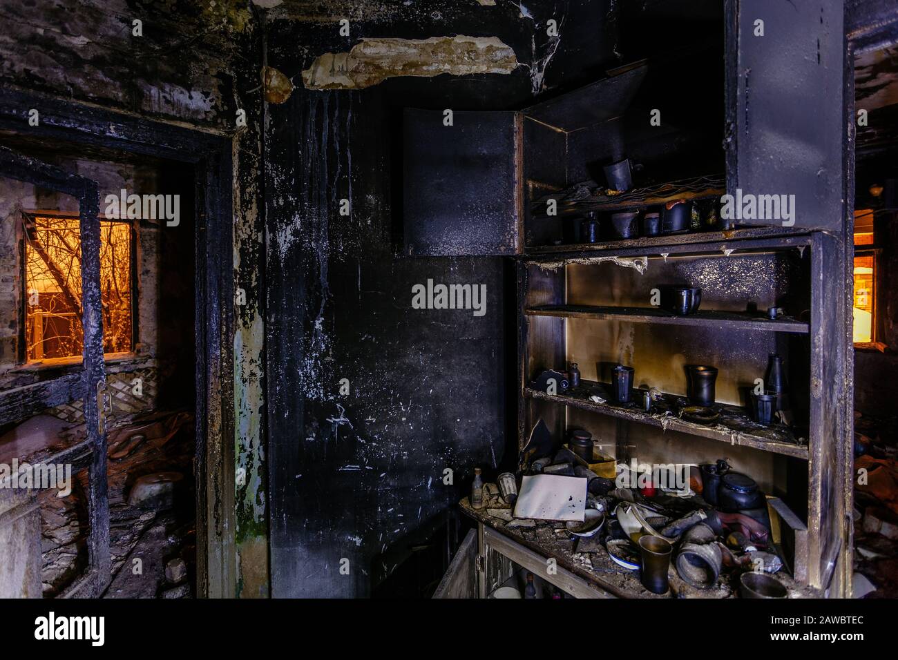 Burnt house interior. Burned furniture, charred walls and ceiling in