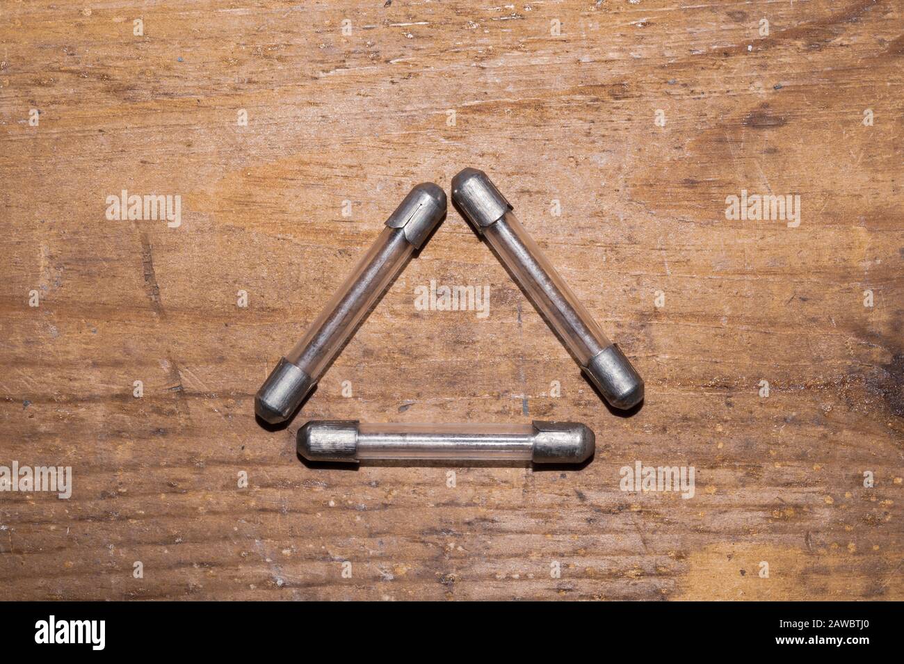 Fuse on wooden background. safety device for overcurrent protection. protection of an electrical circuit Stock Photo
