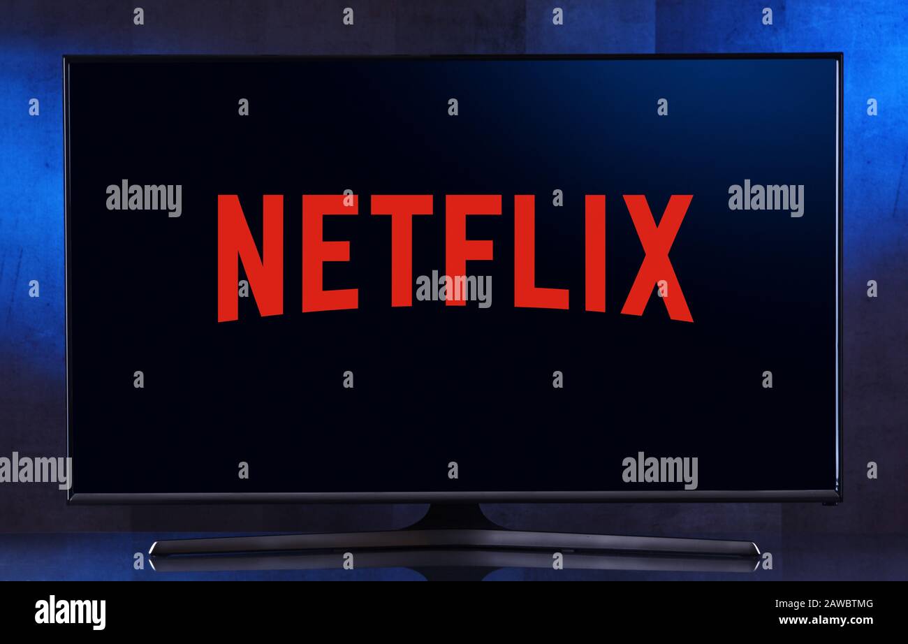 POZNAN, POL - FEB 04, 2020: Flat-screen TV set displaying logo of Netflix, an American media-services provider headquartered in Los Gatos, California, Stock Photo