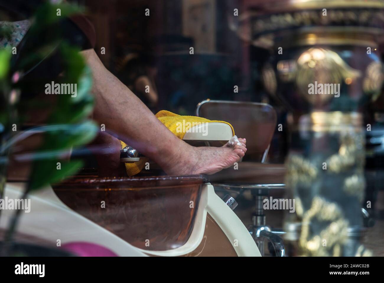 Foot resting in a foot massage parlor in Chinatown, Manhattan, New York