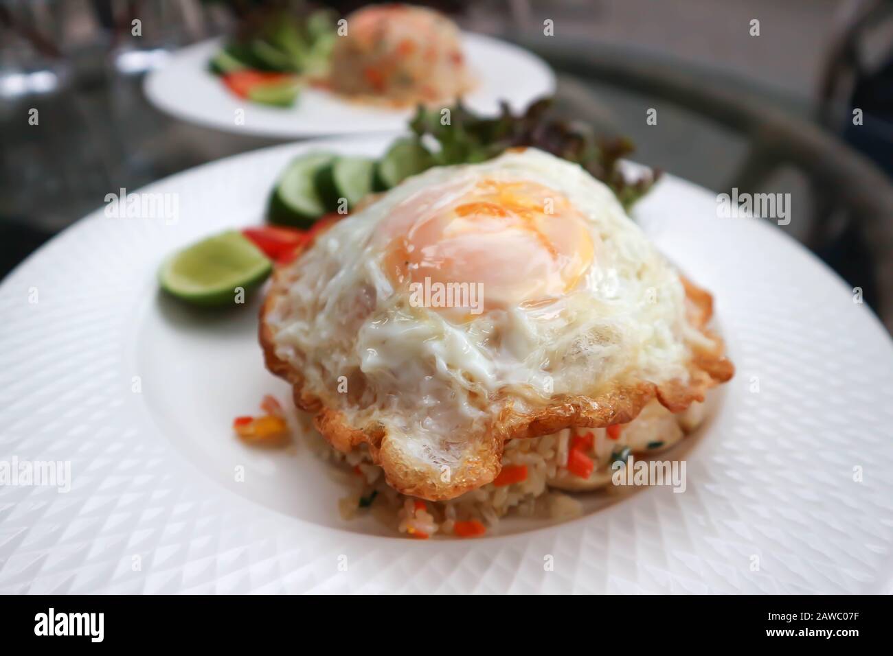 stir-fried rice with fried egg topping Stock Photo