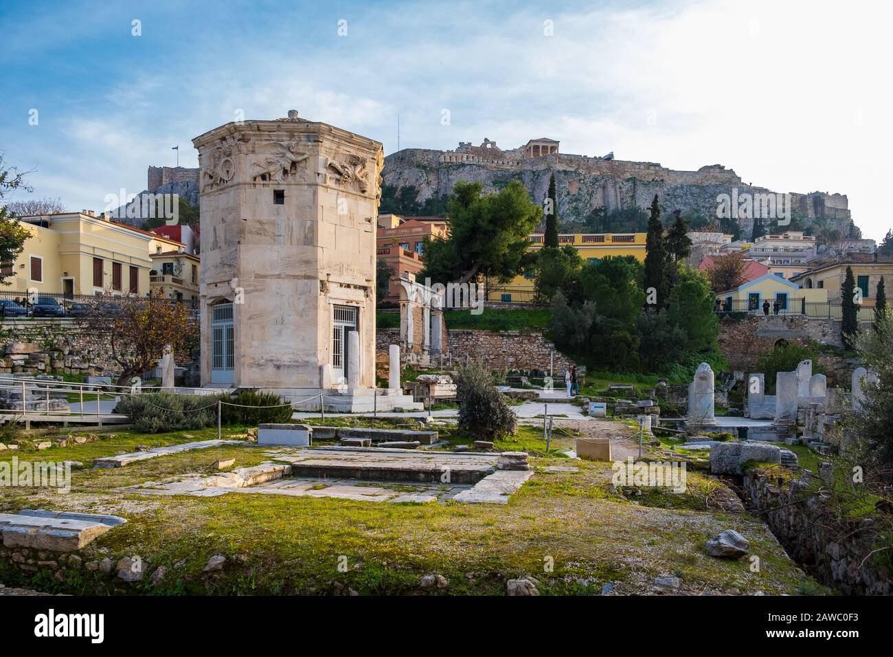 Tower of the Wind-gods in Roman Agora and Acropolis in the background shot on a winter afternoon Stock Photo