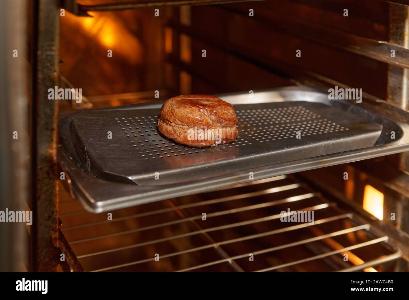 Fillet mignon steak in convection oven, professional restaurant cooking Stock Photo