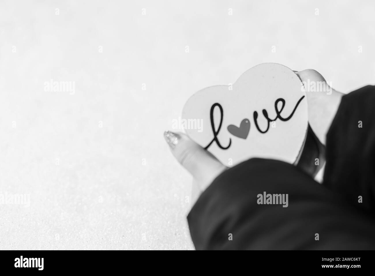 Woman Hand Holding A White Heart With Love Writing Valentine s Day