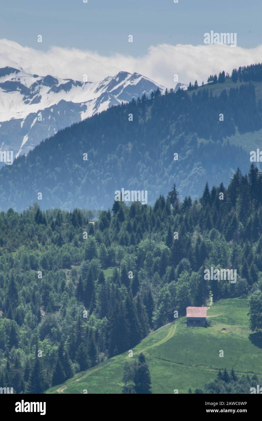 Scenic view on single house in the Alps mountains, Switzerland ...