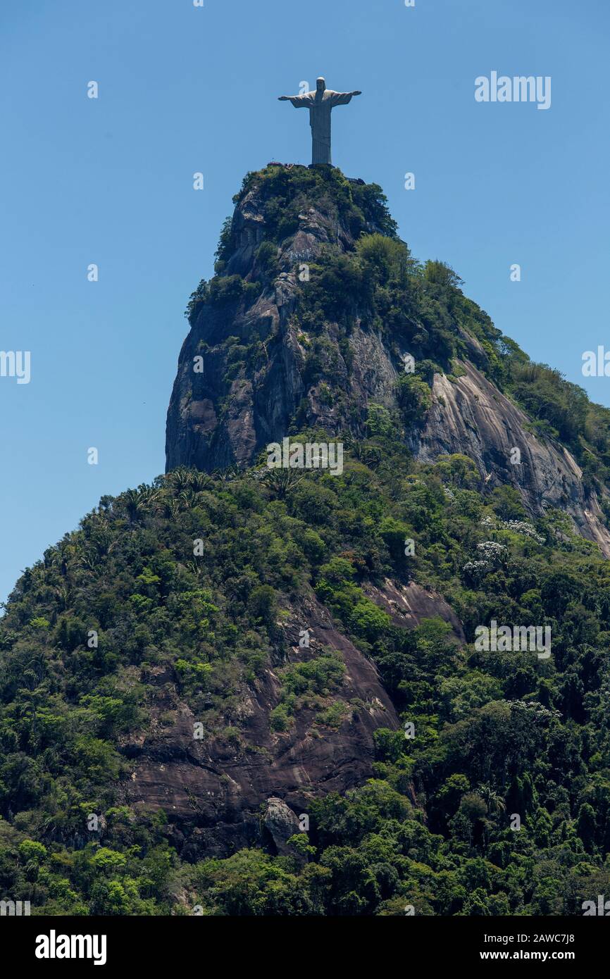 Art déco Christ the Redeemer statue stands at 709 m above sea level over Corcovado hill, Rio de Janeiro. Stock Photo