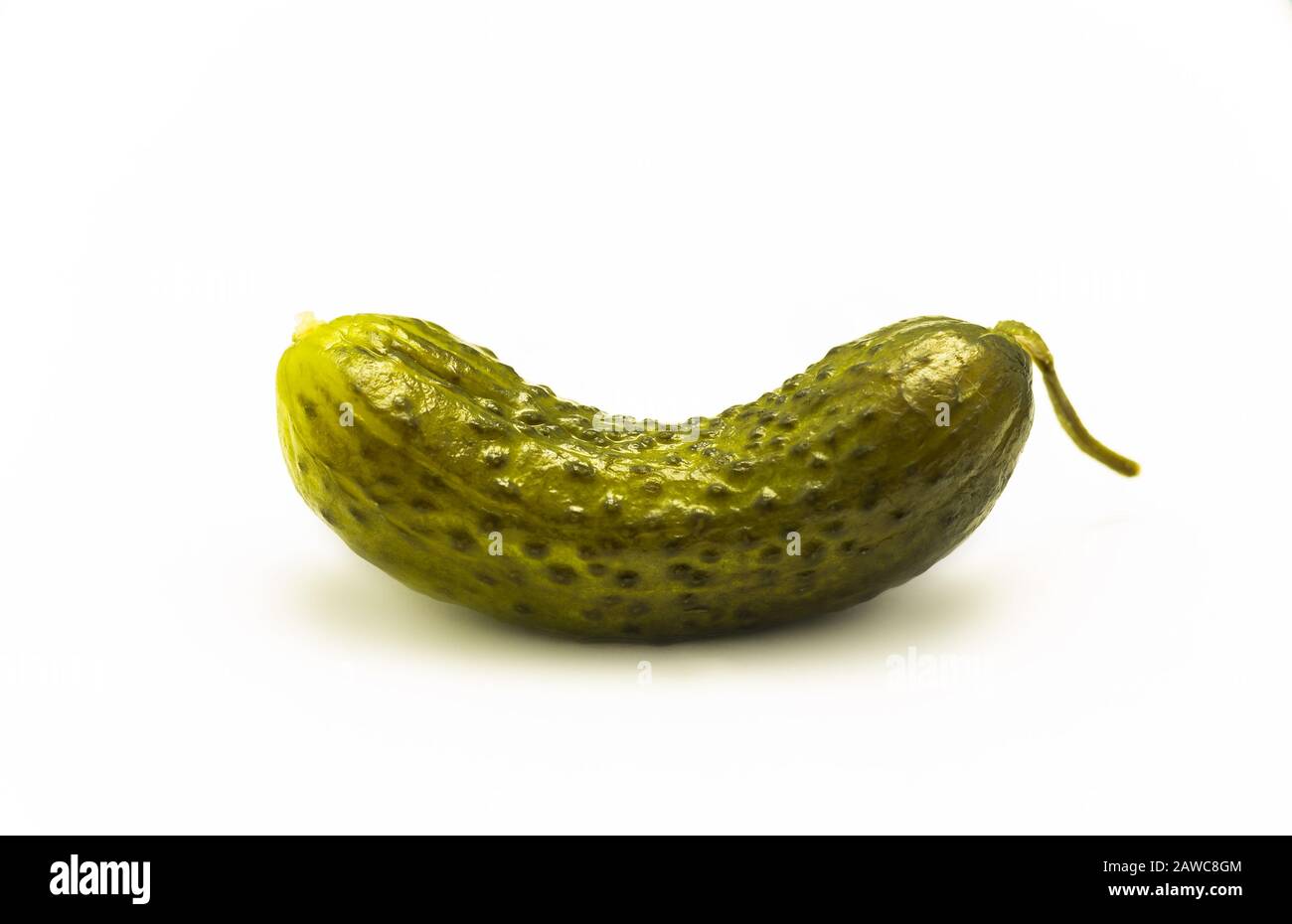 lone pickled cucumber on white Stock Photo