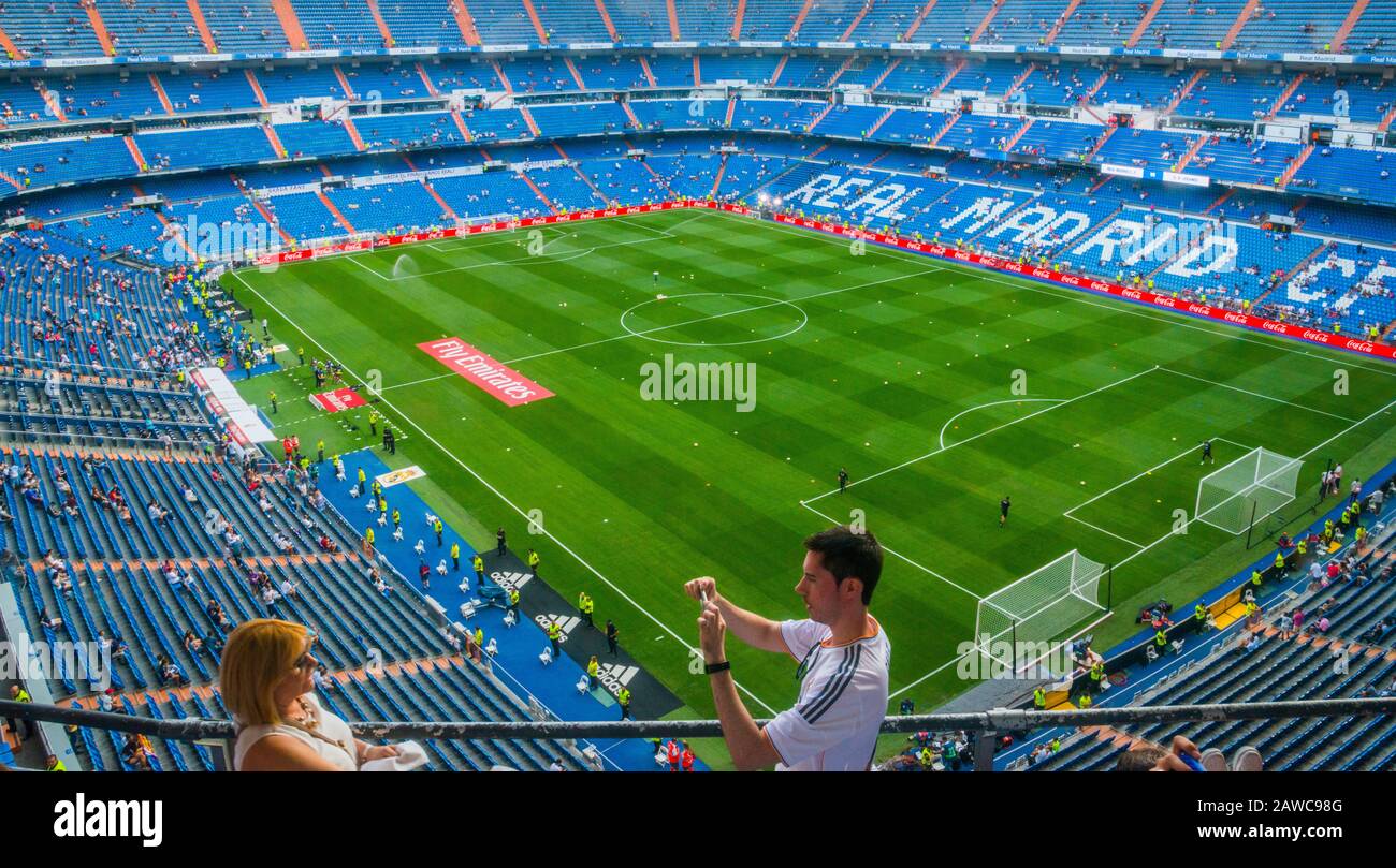 People taking photos before a football match. Santiago Bernabeu stadium, Madrid, Spain. Stock Photo