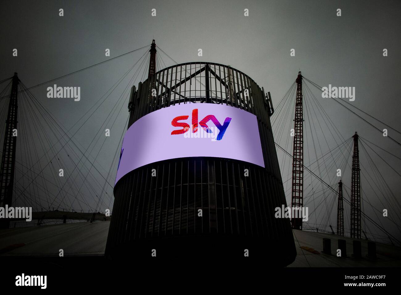 The exterior of the O2 Millennium Dome in North Greenwich, London with an electronic advertising hoarding from Sky Stock Photo