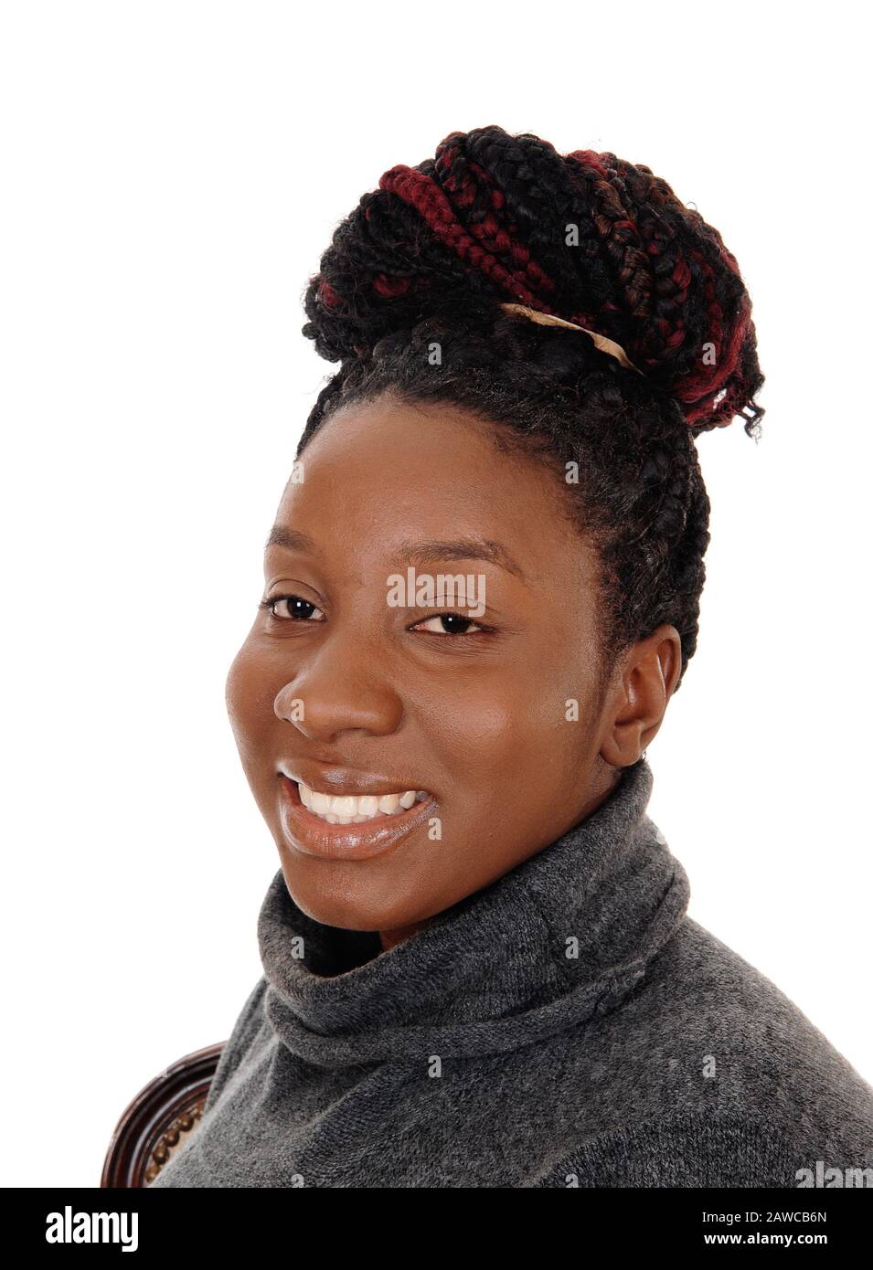 A close up image of an African American woman with her curly hair as a ...
