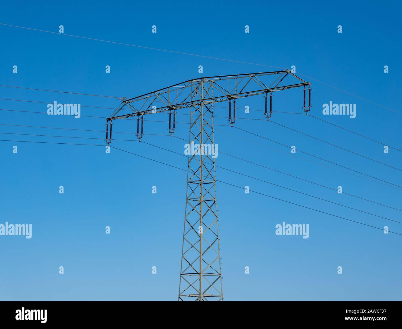 Electricity pylon with blue sky Stock Photo - Alamy