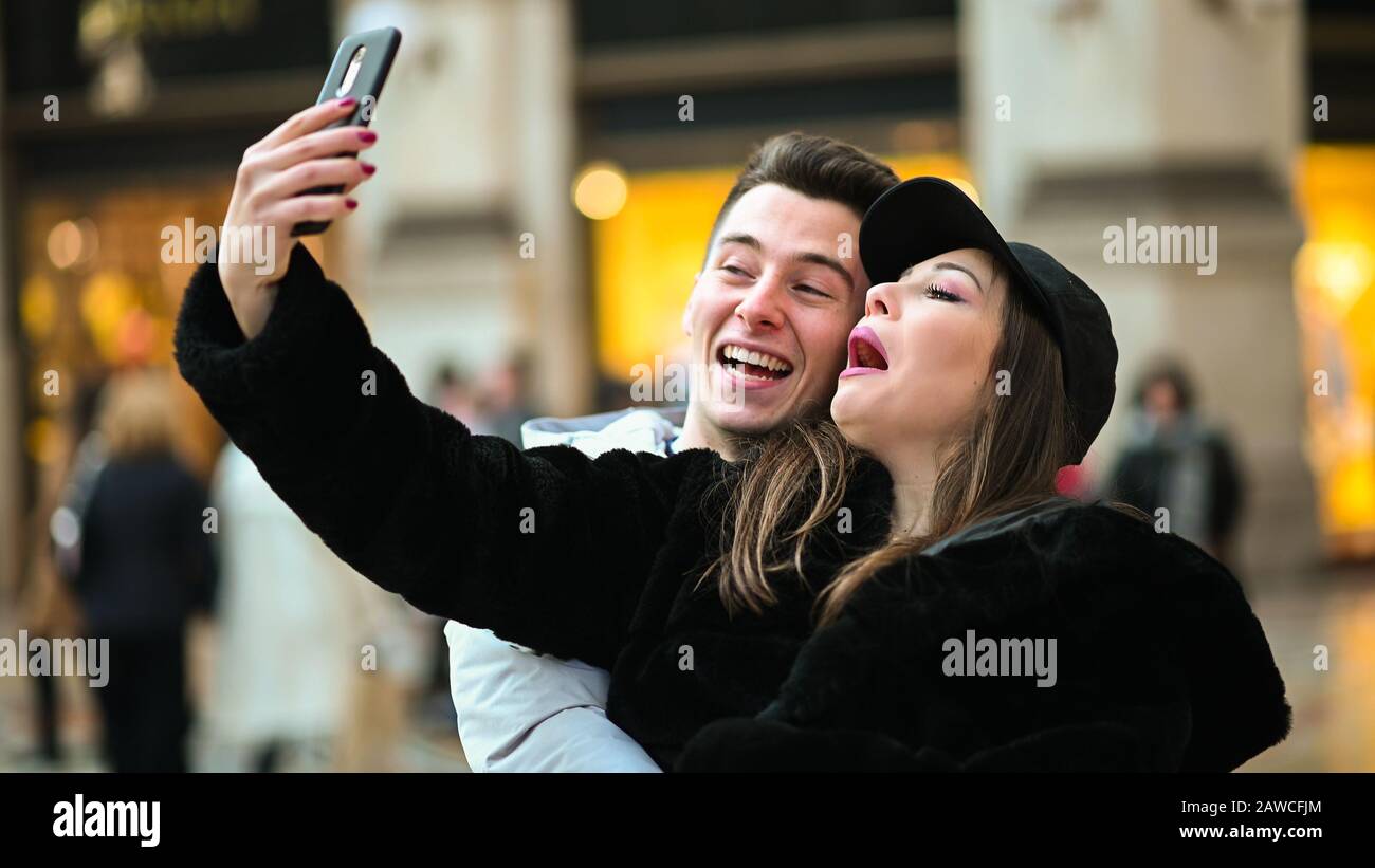 Couple of turists taking a selfie in the city Stock Photo