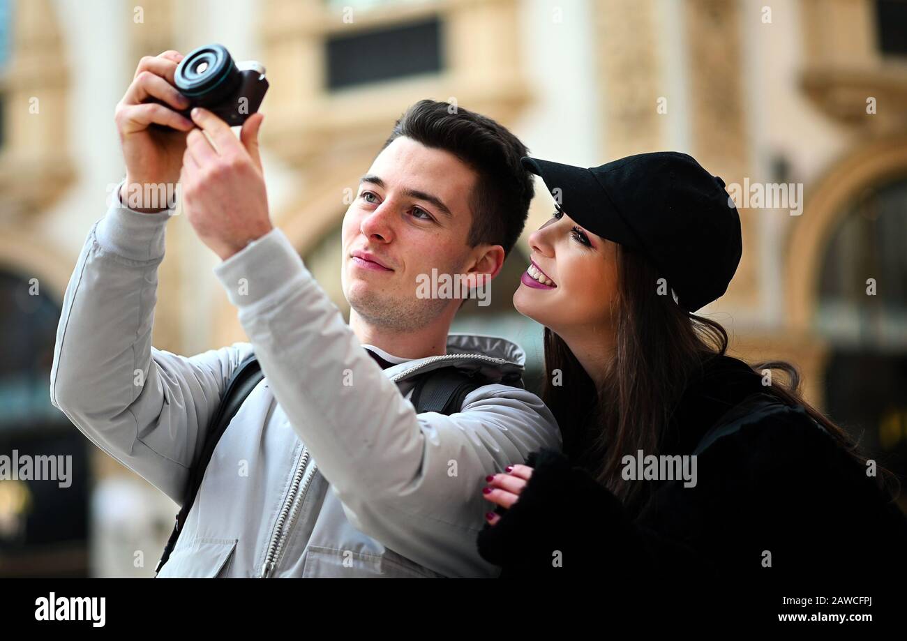 Young couple of turists taking pictures in the city Stock Photo