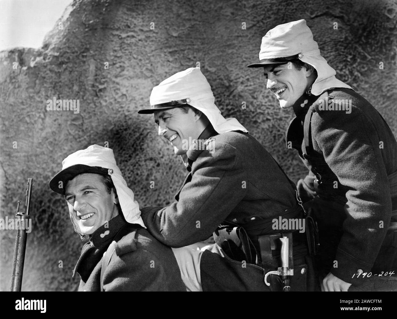 GARY COOPER as Beau Geste RAY MILLAND as John Geste and ROBERT PRESTON as Digby Geste in BEAU GESTE 1939 director WILLIAM A. WELLMAN novel P.C. WREN Paramount Pictures Corporation Stock Photo