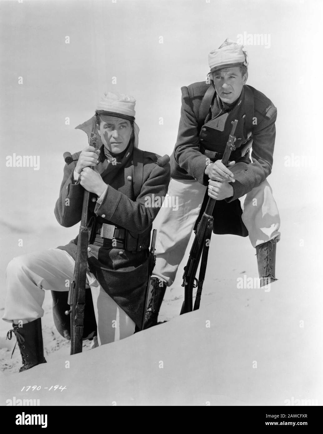 RAY MILLAND as John Geste and GARY COOPER as Beau Geste in BEAU GESTE 1939 director WILLIAM A. WELLMAN novel P.C. WREN Paramount Pictures Corporation Stock Photo