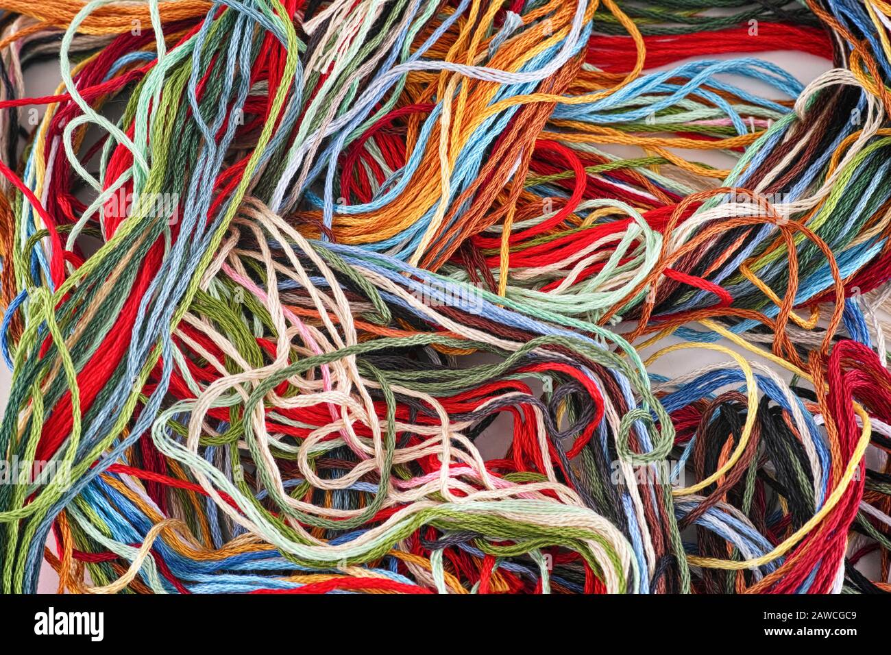 Colorful embroidery thread background. Close up Stock Photo - Alamy
