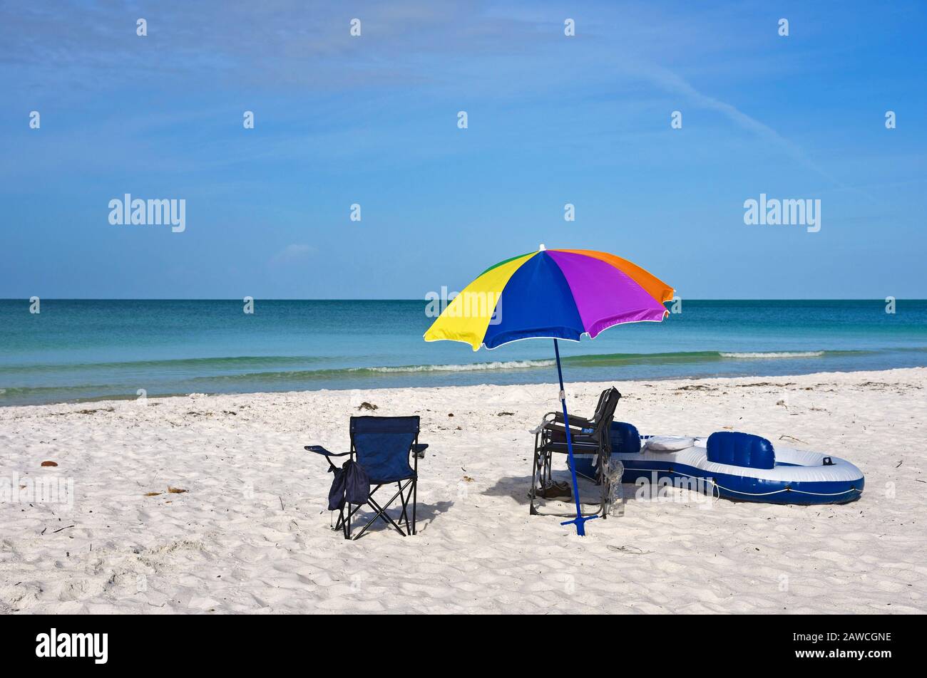 Beach Chairs with Umbrella and Raft on the Beach of Anna Maria Island ...