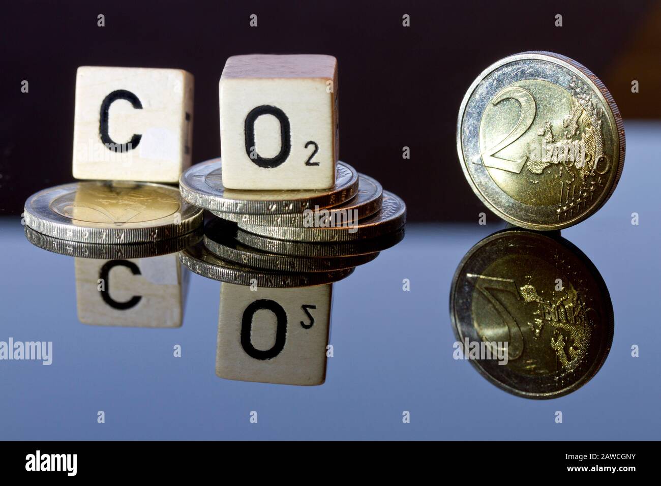 CO2-Abgabe und CO2-Steuer, CO2-certificates symbolized by money, letters and reflexion refexions Stock Photo