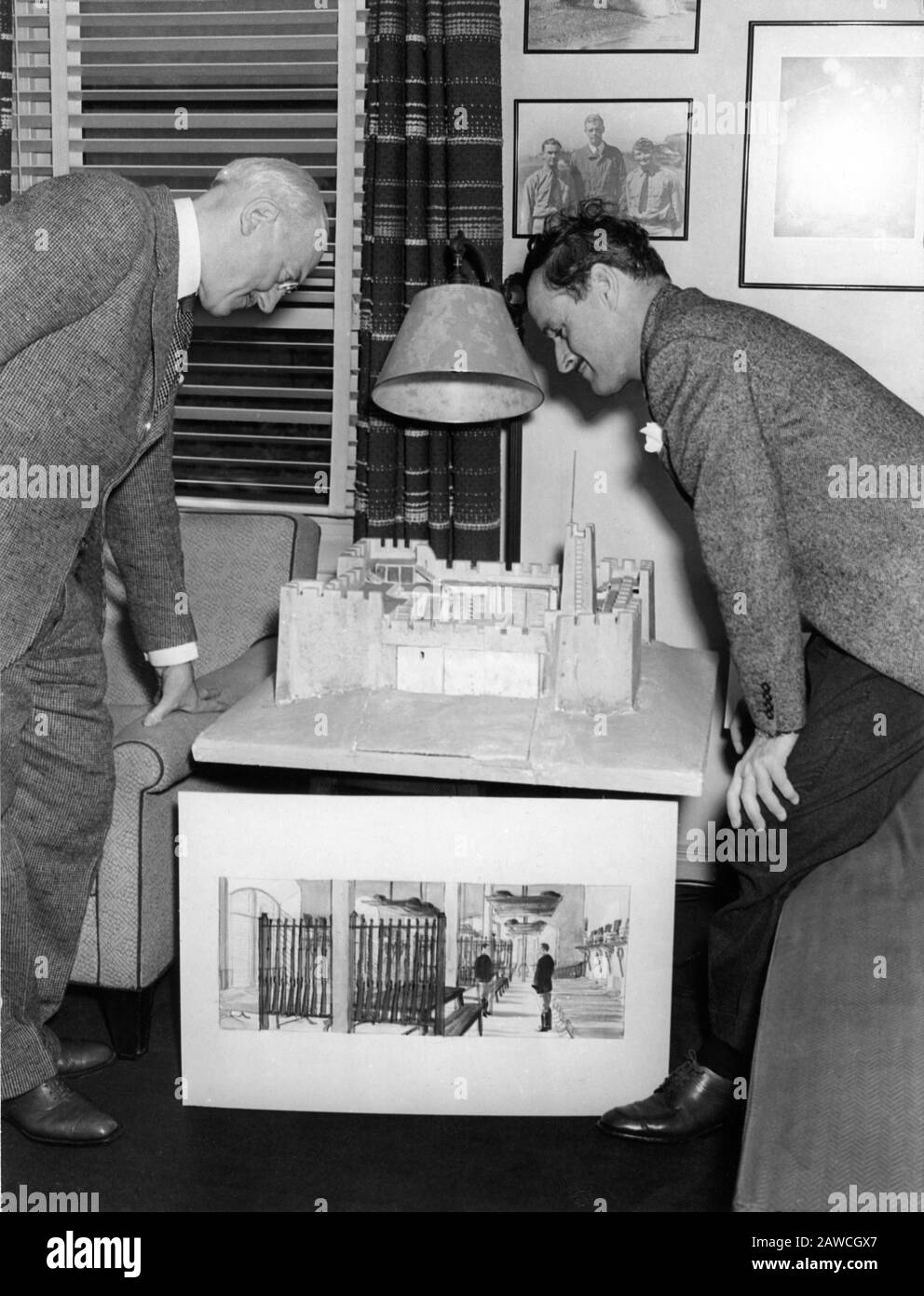 Technical Advisor Colonel ROBERT GERARD of the French Foreign Legion and Director WILLIAM A. WELLMAN looking at model of Fort Zinderneuf during preparation for filming BEAU GESTE 1939 novel P.C. WREN Paramount Pictures Corporation Stock Photo