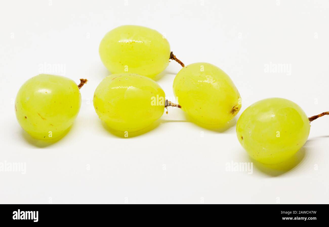 five green grapes on white background Stock Photo Alamy