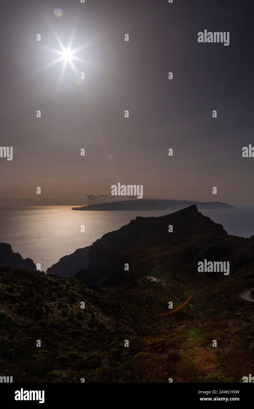 Sunburst over La Gomera from Tenerife, Canary Islands Stock Photo