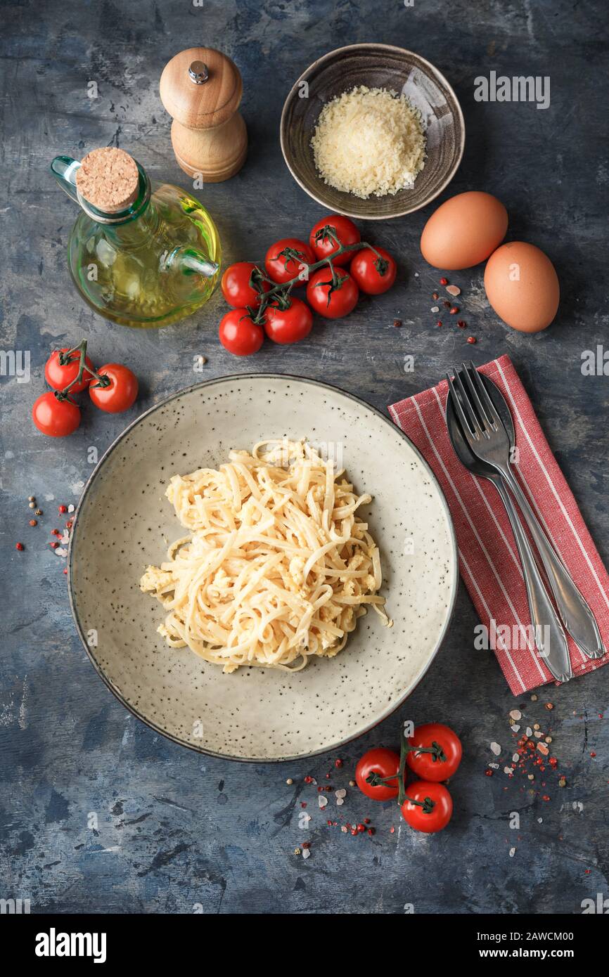 Pasta Linguine with scrambled eggs and parmesan cheese. Traditional