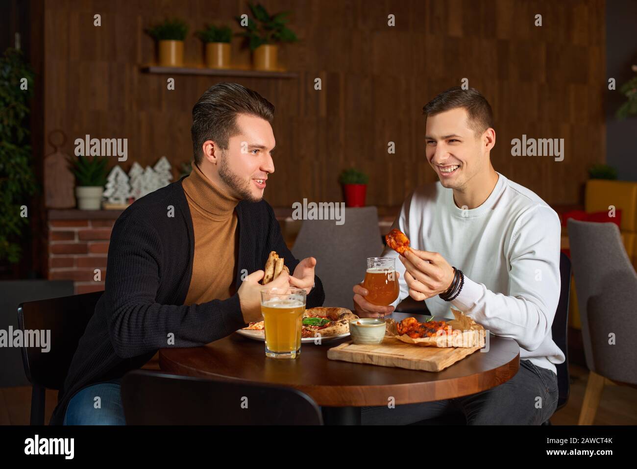 Two Male Friends Laughing In An Istanbul Cafe Stock Photo