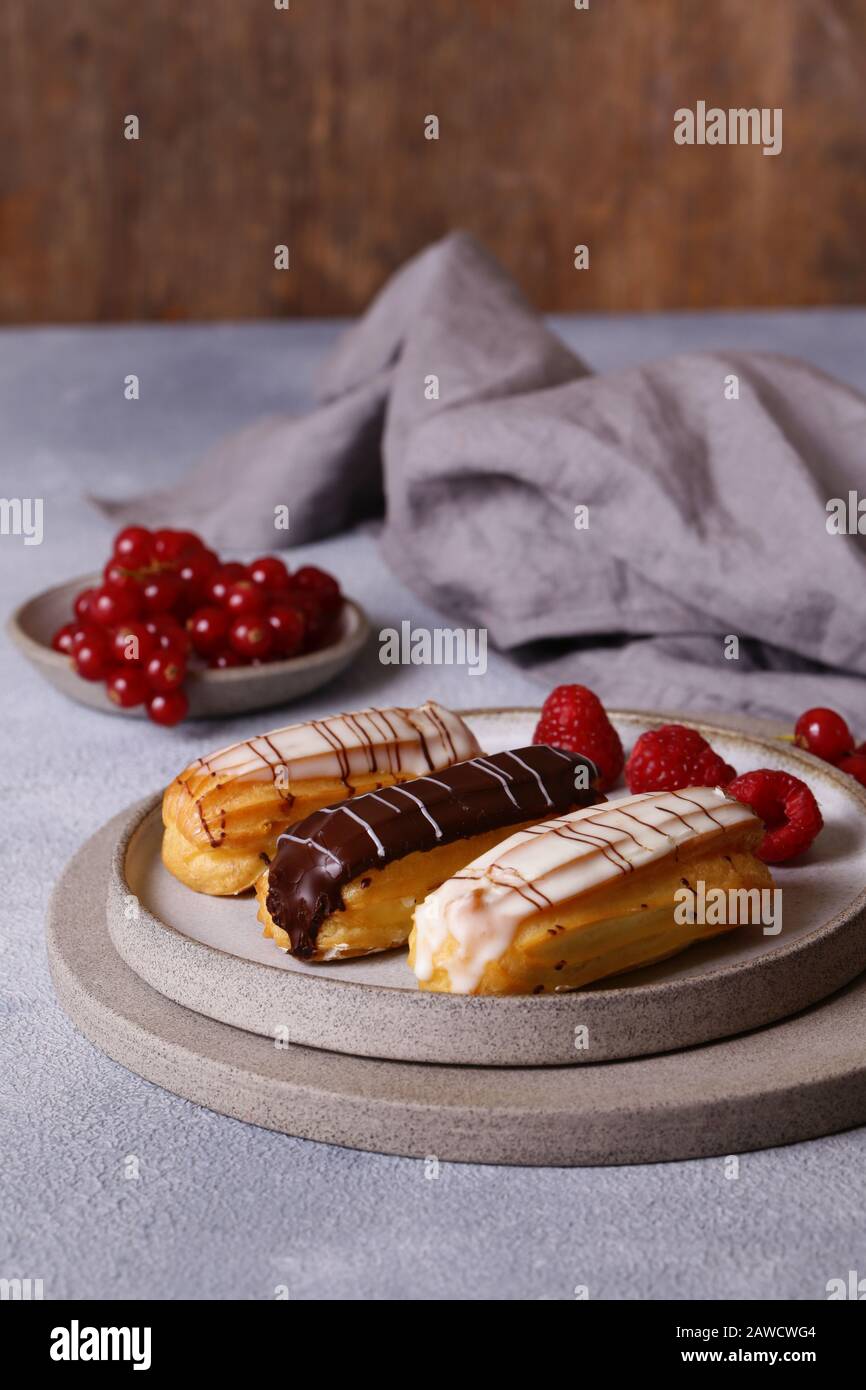 French pastries of choux pastry eclairs Stock Photo Alamy