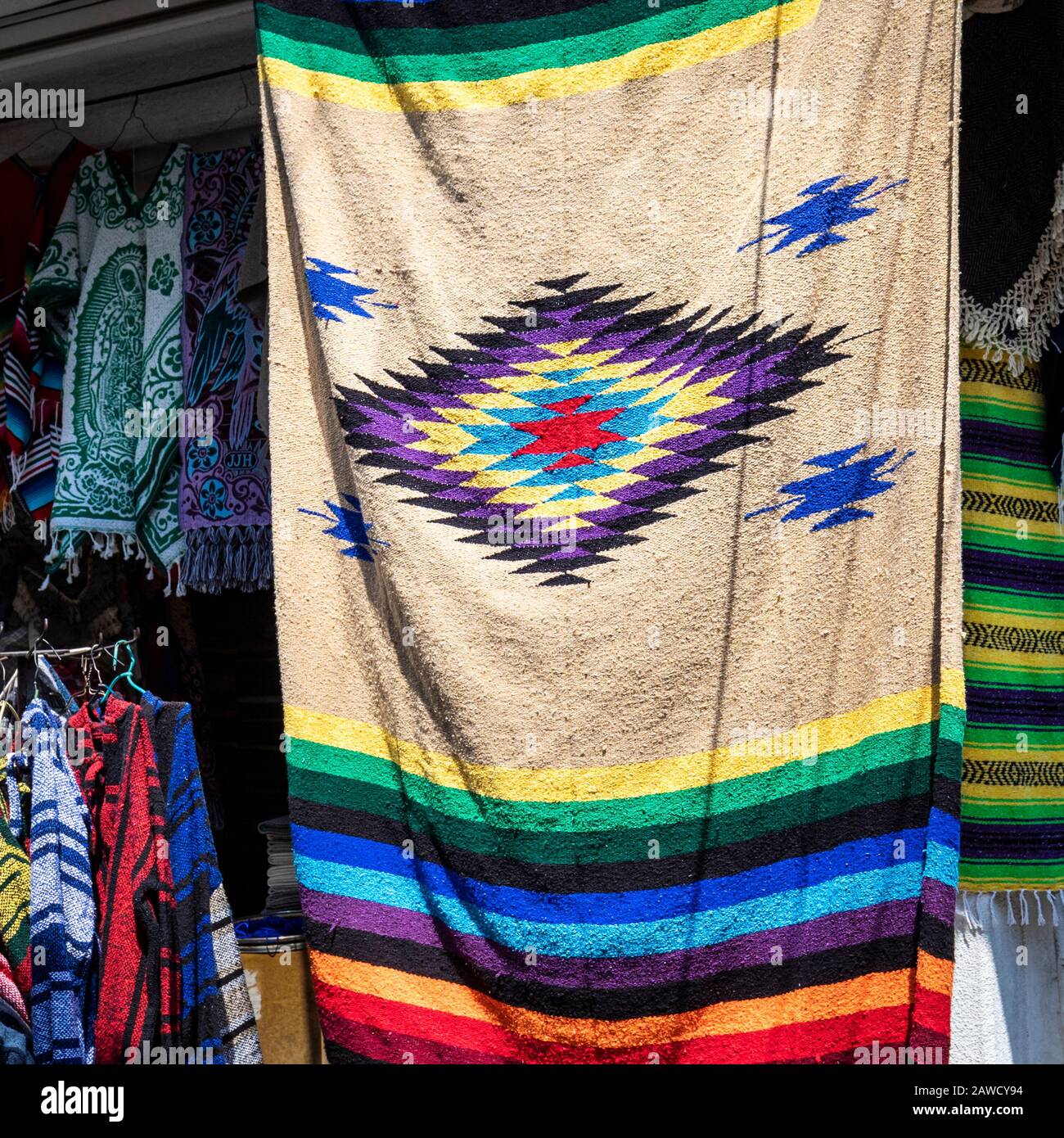 Rugs hang in the Ciudadela market in Mexico City. Stock Photo