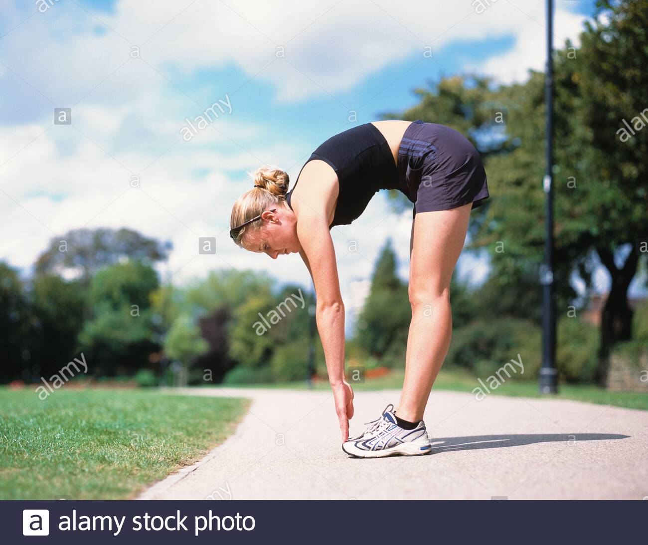 Woman Bending Over Touching Toes High Resolution Stock Photography and